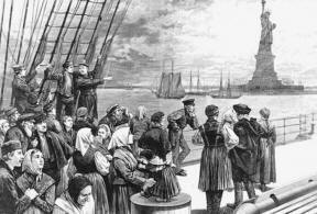 Iimmigrants arriving at Ellis Island see the Statue of Liberty